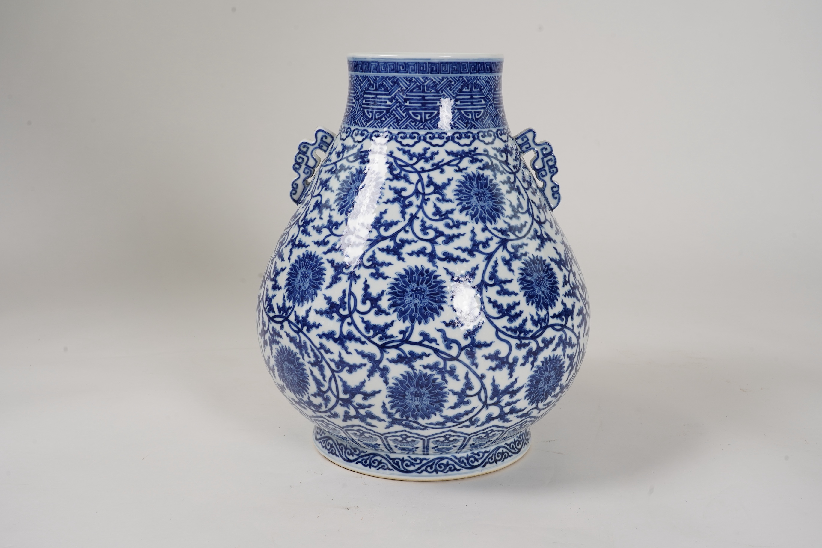 A large Chinese blue and white pear shaped vase, hu, Qianlong seal mark but later